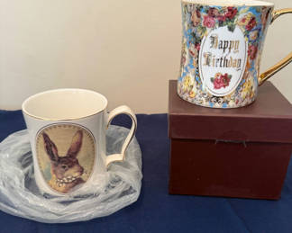 Lot 200: Two ceramic mugs: floral 'Happy Birthday' mug and rabbit portrait mug