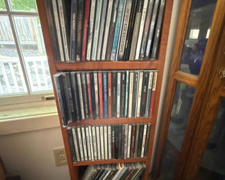 Lot 57: CD collection on wooden shelf