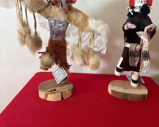 Lot 51: Kachina-style carved dolls with feather decorations