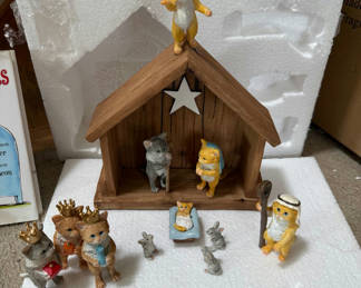 Lot 150: Cat Figurine Collection with Nativity Scene and Books