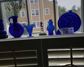 Lot 93: Cobalt blue glass vases and plate with hanging dreamcatchers