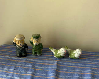 Lot 179: Ceramic salt and pepper shakers: two sailors and two birds