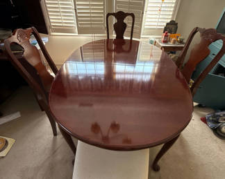Lot 101: Oval wooden dining table with chairs