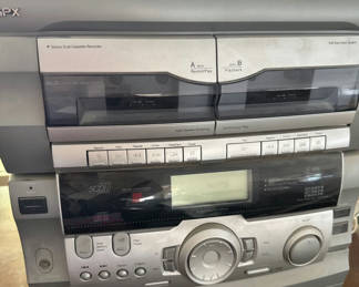 Lot 26: Vintage multi-component stereo with dual cassette decks and speakers