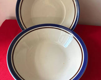 Lot 153: Blue-rimmed hand-painted ceramic plates