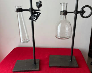 Lot 111: Decorative metal stand with hanging glass vases