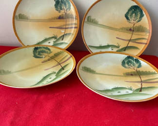 Lot 129: Nippon - Set of four ceramic plates with landscape scene