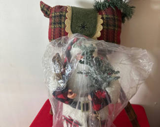 Lot 73: Plaid Santa figure in front of plaid reindeer sculpture