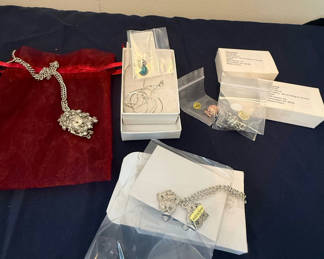 Lot 204: Silver-tone jewelry set with turquoise pendant, bracelet, and assorted charms