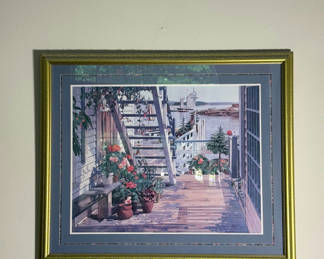 Lot 180: Framed seaside porch print with potted flowers