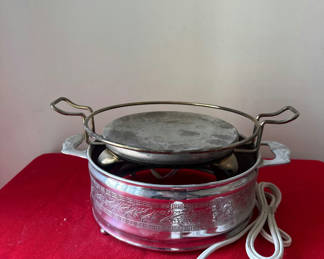 Lot 113: Ornate electric warming pot with stand