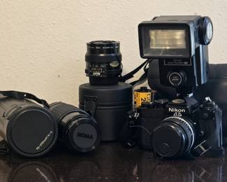 Nikon vintage 35mm camera with several extra lens and carrying bag + a roll of Kodak gold film