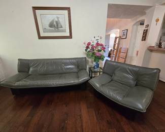 gray leather couch and oversized chair