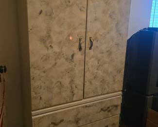 Bedroom suite includes headboard with 2 nightstands and armoire.