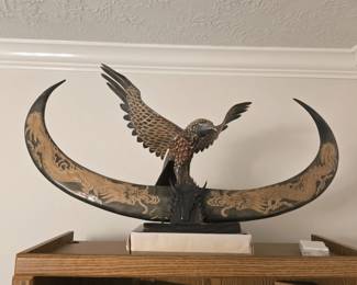 eye-catching carved bird-of-prey on water buffalo horn sculpture with scrimshaw dragon
