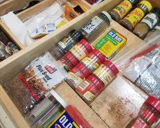 Kitchen cabinets feature a spice tray