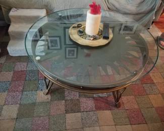 Glass top coffee table with metal sunbusrt base