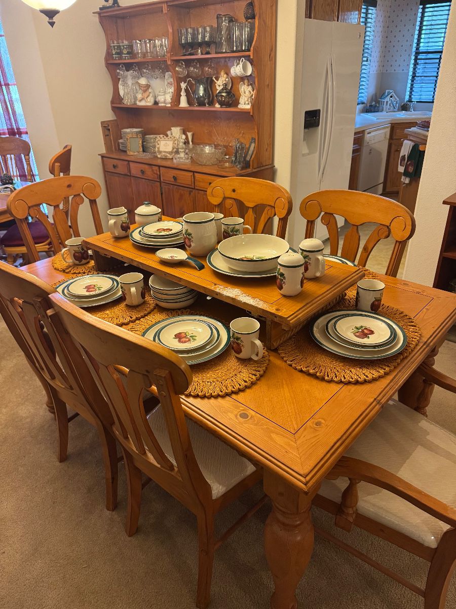 Wooden dining table with additional leaf. 