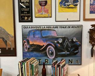 Vintage posters and tin beer signs.