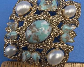 Brooches.