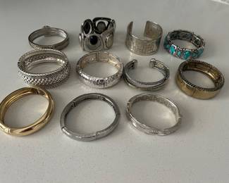 Enormous amount of silver tone and gold tone bracelets - mainly chicos