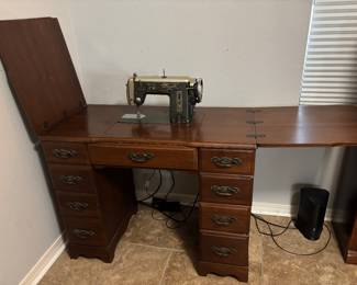 Sewing machine cabinet/table w Vintage Universal Zig-Zag machine. $ 100. 36.5”- 64.5” w 19” d 30”t