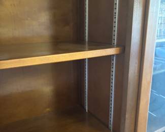 Dark Maple bookcase w adjustable shelves and 4 doors $ 450.00. 64”w 13”d 84”t