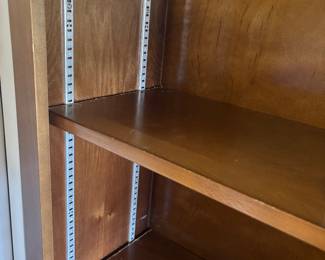 Dark Maple bookcase w adjustable shelves and 4 doors $ 450.00. 64”w 13”d 84”t