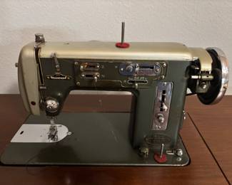 Sewing machine cabinet/table w Vintage Universal Zig-Zag machine. $ 100. 36.5”- 64.5” w 19” d 30”t