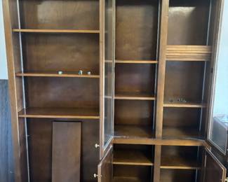 Dark Maple bookcase w adjustable shelves and 4 doors $ 450.00. 64”w 13”d 84”t