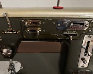 Sewing machine cabinet/table w Vintage Universal Zig-Zag machine. $ 100. 36.5”- 64.5” w 19” d 30”t