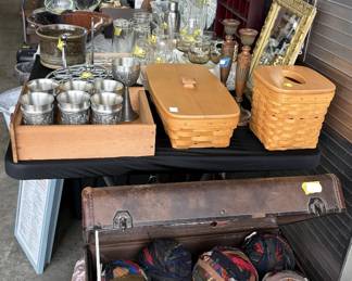 baskets, trunks, vintage suitcase, rug fabric balls, pewter cups