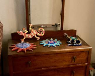Dresser with mirror, lizards, sun mask