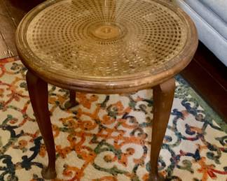 Round glass topped table with Cain insert