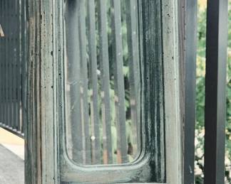 Cast concrete garden mirror