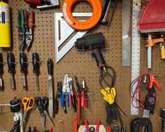 Assorted Hand and Power Tools on Pegboard