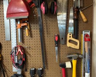 Assorted Hand Tools and Workshop Equipment Mounted on Pegboard