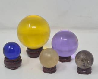 147 FiveAssortedDecorativeCrystalGlassStoneSpheresonStands