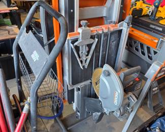  RIDGID 10-inch portable jobsite table saw with a rolling stand
