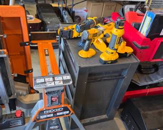 Ridgid Super Clamp Portable Work Station (Left) collection of DeWalt 18V Cordless Power Tools (Right)