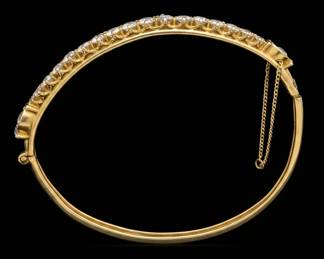 Vintage Gold Tone Hinged Bangle Bracelet with Clear Stones