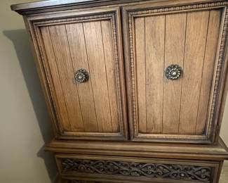Tall dresser with 5 drawers, 3 located behind top front doors 