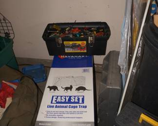 animal trap in box and tool box with tools 