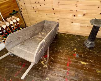Antique wood wheelbarrow, sundial