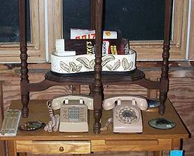 Small table, cradle phones, child's desk