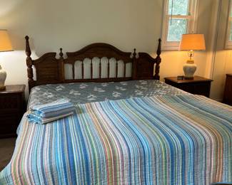 King size bed with two matching nightstands and a triple dresser in another picture.