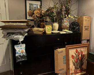 Various wall art and flower arrangements