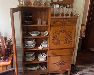 Antique Victorian Oak Side-by-Side Secretary & Bookcase — c. 1900  Gorgeous turn-of-the-century oak combination secretary desk and display cabinet featuring a tall glass-front bookcase, drop-front writing desk, drawers and lower cabinet storage. Beautiful carved detailing throughout with an attached mirror, decorative hardware and wonderful original aged patina. A substantial late-Victorian statement piece with tons of character. Circa 1890–1915.