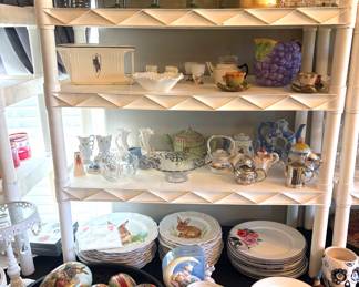 Collection of Easter plates and platters, vintage handpainted egg decor, tea pots and glasses.