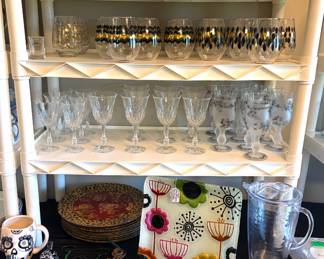 Collection of glassware, decorative plates and charges. Including holiday Peggy Karr and Lori Siebert.